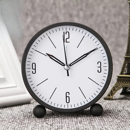 Réveil rond minimaliste noir et blanc à aiguilles -  - reveil-analogique-rond - ["analogique","petit","r\u00e9veil analogique","simple","voyage"]