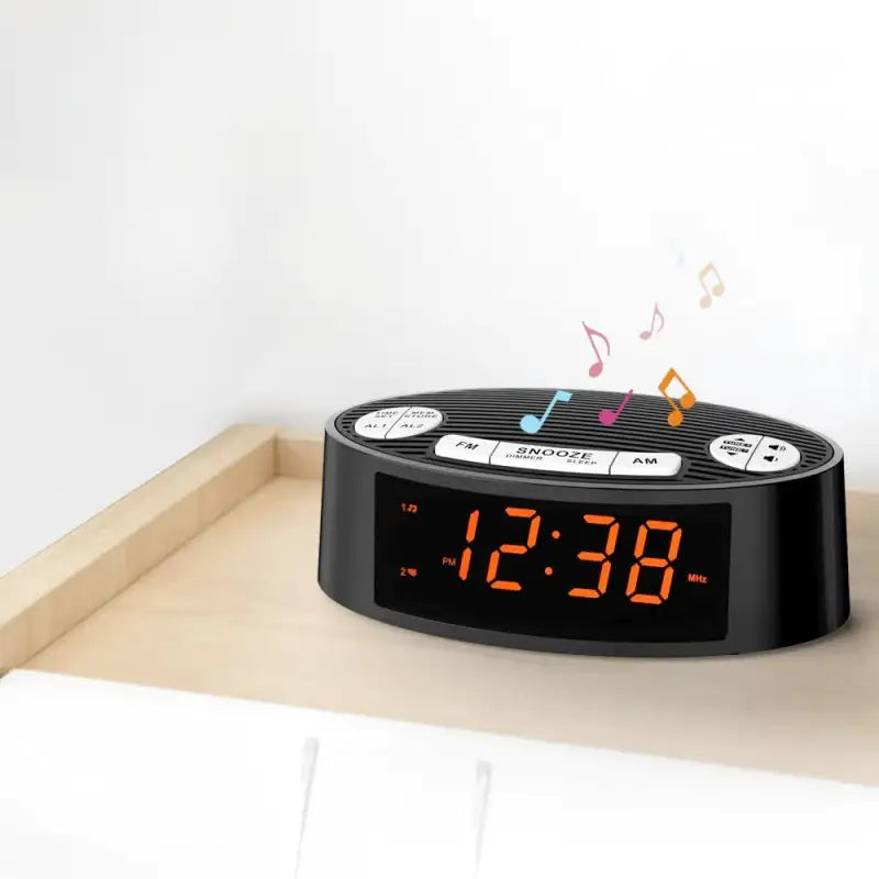 Radio réveil ovale noir à LED orange -  - radio-reveil-connecte-heure - ["connect\u00e9","digital","lumineux","num\u00e9rique","petit reveil","radio reveil","radio r\u00e9veil connect\u00e9","Radio R\u00e9veil Lumineux","r\u00e9veil connect\u00e9","r\u00e9veil digital","simple"]