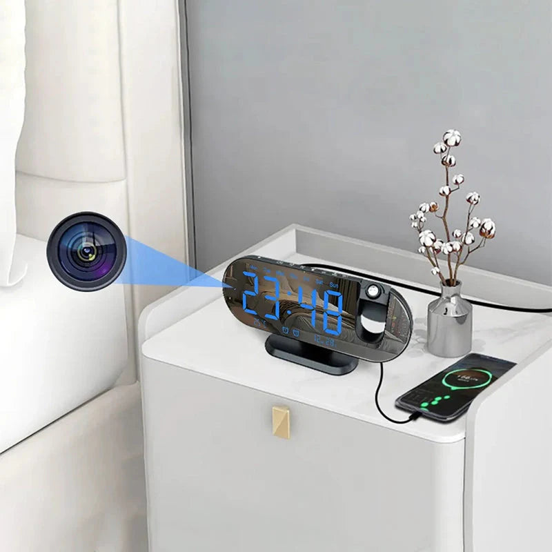 Réveil projecteur ovale noir avec caméra intégrée Wi-Fi -  - reveil-camera-espion-wifi - ["cam\u00e9ra espion","connect\u00e9","moderne","num\u00e9rique","r\u00e9veil digital"]