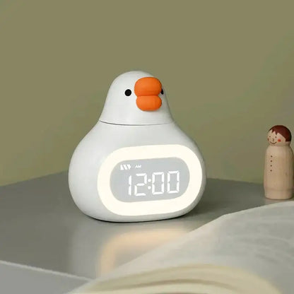 Réveil canard numérique en plastique jaune mat -  - reveil-enfant-avec-veilleuse - ["enfant","lumineux","lumi\u00e8re","num\u00e9rique","petit","r\u00e9veil digital","r\u00e9veil enfant","simple","veilleuse"]