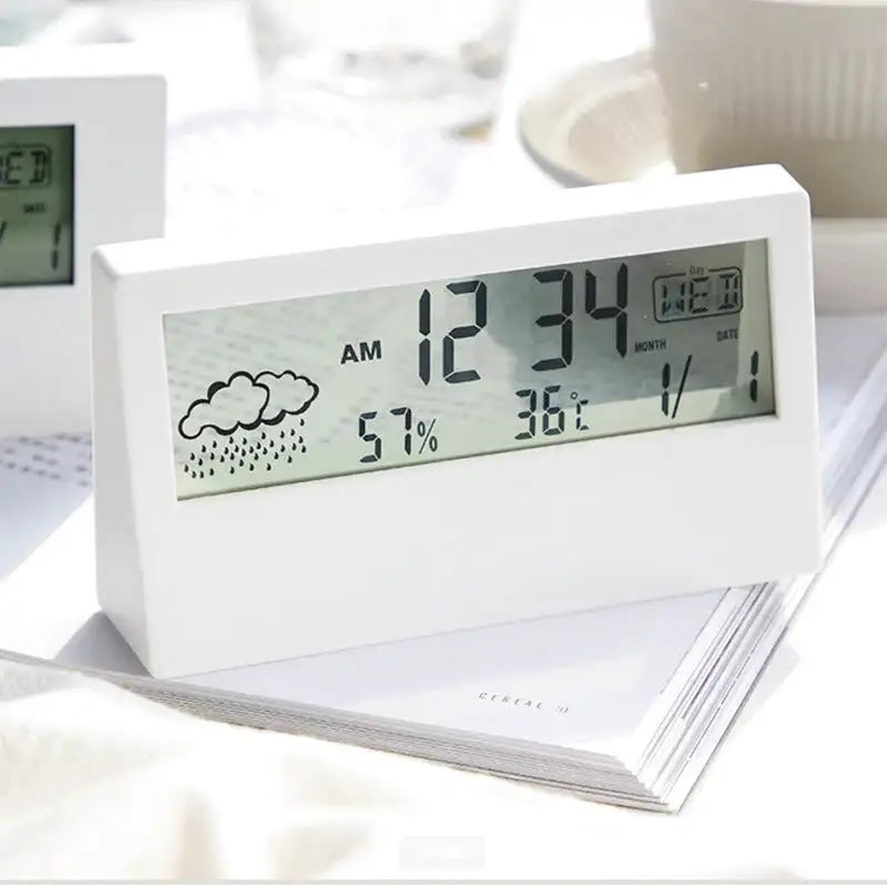 Réveil digital blanc mat avec affichage météo intégré