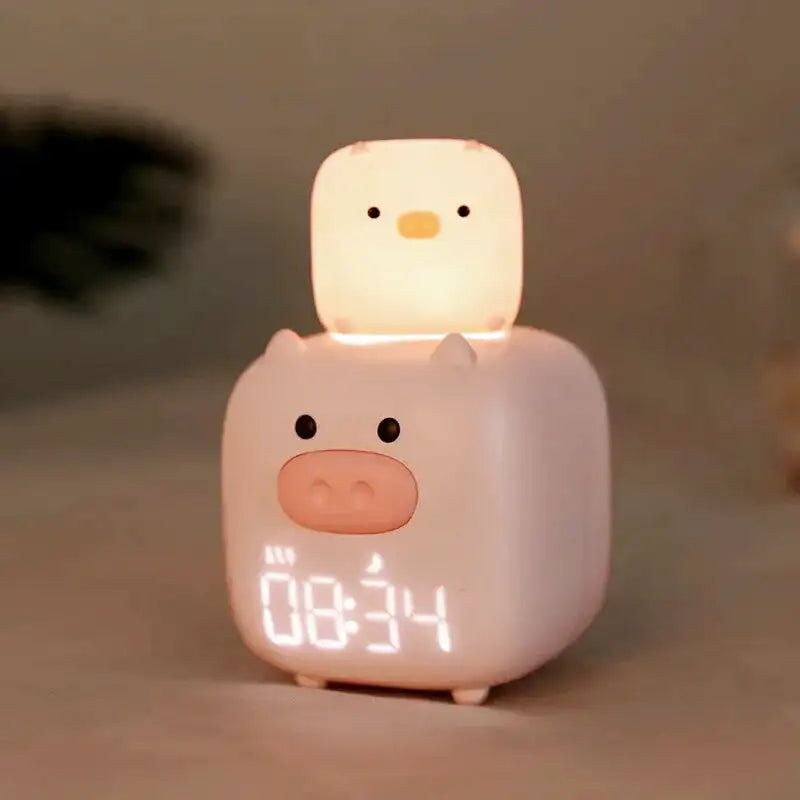 Réveil enfant en forme de cochons empilés rose pâle