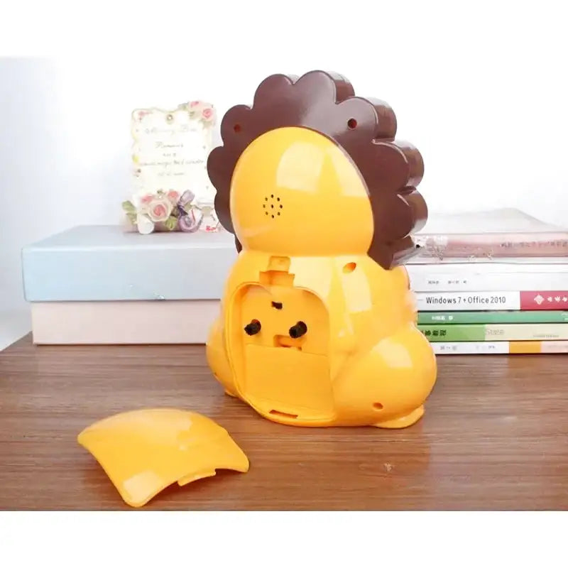 Réveil lion en plastique orange pour chambre d’enfant -  - reveil-enfant-lion - ["analogique","enfant","petit","r\u00e9veil enfant","simple","\u00e9ducatif"]