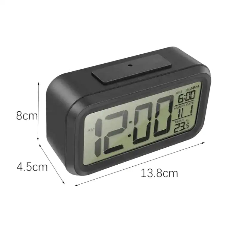 Réveil numérique compact noir avec affichage multifonction -  - reveil-a-pile-lumineux - ["digital","Jour Nuit","lumineux","num\u00e9rique","petit reveil","Radio R\u00e9veil Lumineux","r\u00e9veil digital","simple"]