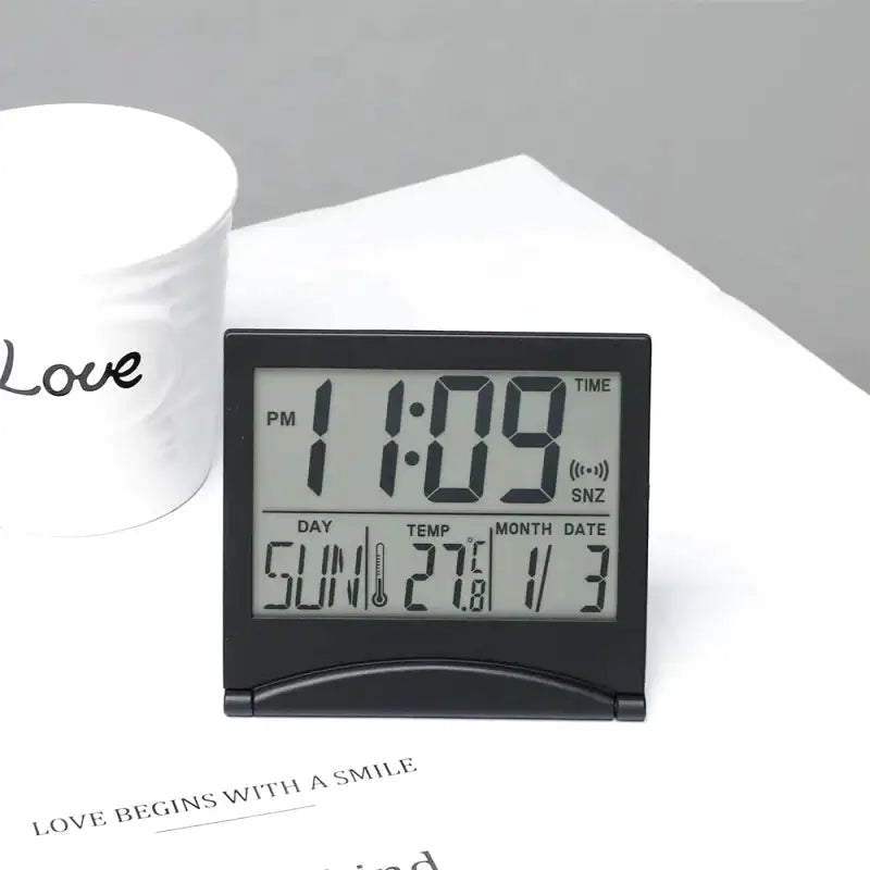 Réveil numérique pliable noir avec affichage multifonction -  - reveil-de-voyage-pliable - ["digital","num\u00e9rique","petit reveil","plastique","r\u00e9veil digital","simple","voyage"]