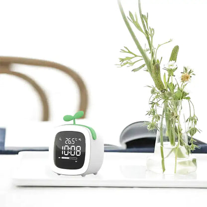 Réveil numérique vert pastel avec pousse décorative -  - reveil-veilleuse-enfant - ["enfant","r\u00e9veil enfant","veilleuse"]